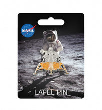 Load image into Gallery viewer, Pin badge attached to card with image of astronaut on the moon. The badge is silver and gold and shaped like space shuttle. The card has the NASA logo in the top left.
