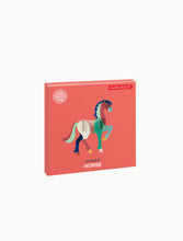 Load image into Gallery viewer, Horse packaging is red box. horse is multi-coloured, mainly green. 
