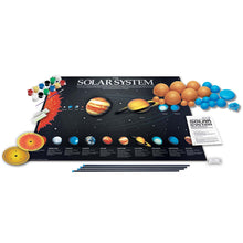 Load image into Gallery viewer, Packaging contents. Poster of the solar system with 2 rows of paints, a brush, flow int he dark paint, card, rods, instructions and planet halves.
