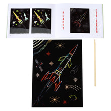 Load image into Gallery viewer, A scratch art sheet featuring a rocket partially uncovered with the wooden stick beside it and the open booklet above it. Booklet is open to the same artwork.
