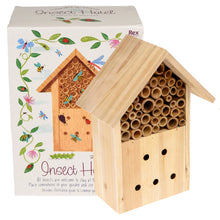 Load image into Gallery viewer, Insect hotel sits in front of cardboard box. 
