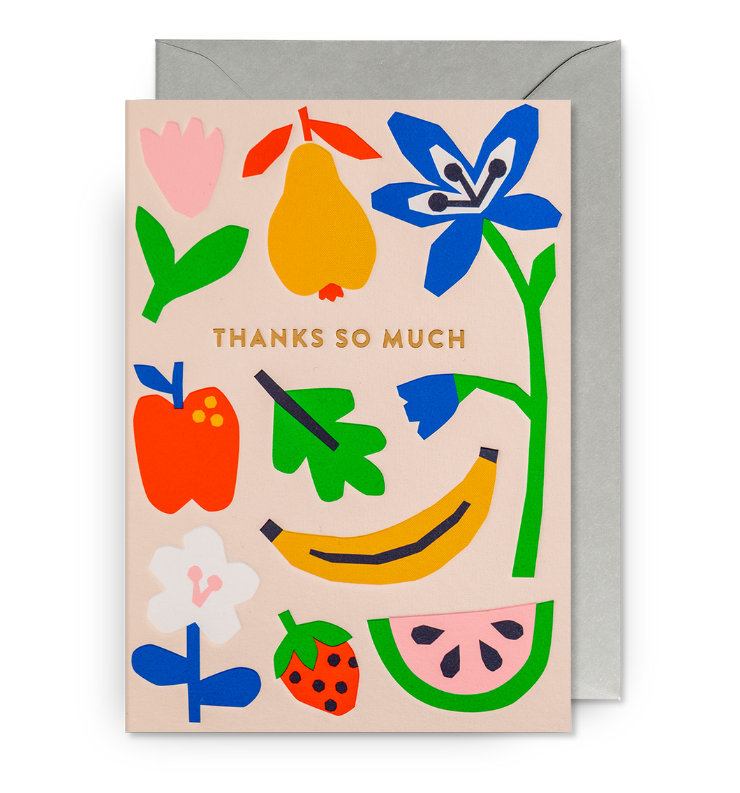 Peach coloured card with colourful blocky illustrations of fruits and flowers. 'Thanks so much' in gold letters across the card. Card sits on grey envelope. 