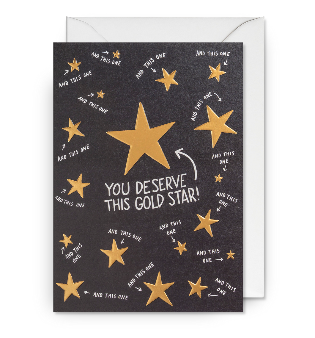 Black card with gold stars. One large gold star in centre has 'you deserve this gold star!' pointing towards it. The other stars have the words 'and this one' with little arrows. 