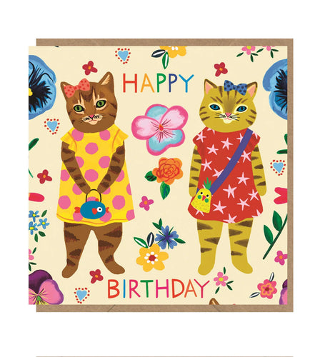 happy birthday card covered in flowers and has 2 cats standing in yellow and red dresses with purses 