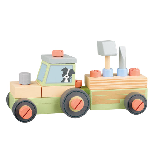 wooden tractor and trailer with illustration of dog in the cab. Trailer holds hammer and screwdriver.