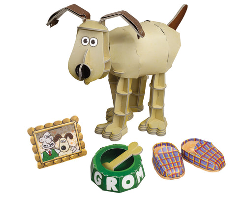 Assembled cardboard Gromit with slippers, dog bowl and bone, and framed print of Wallace and Gromit.