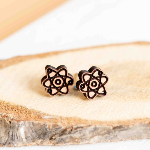 Two earrings shaped like atoms with lines & circles to make the classic structure. 