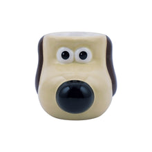 Load image into Gallery viewer, Front of egg cup shows beige dog with brown ears and black nose 
