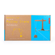 Load image into Gallery viewer, Cardboard box packaging is brown kraft on the left and blue on the right. A photo of the assembled crane is on the right, while the words on the left read &quot;Newton&#39;s Lab, make your own pulley crane. Learn about newton&#39;s third law and how for every action there is an equal and opposite reaction. discover the world of physics while playing.&quot;
