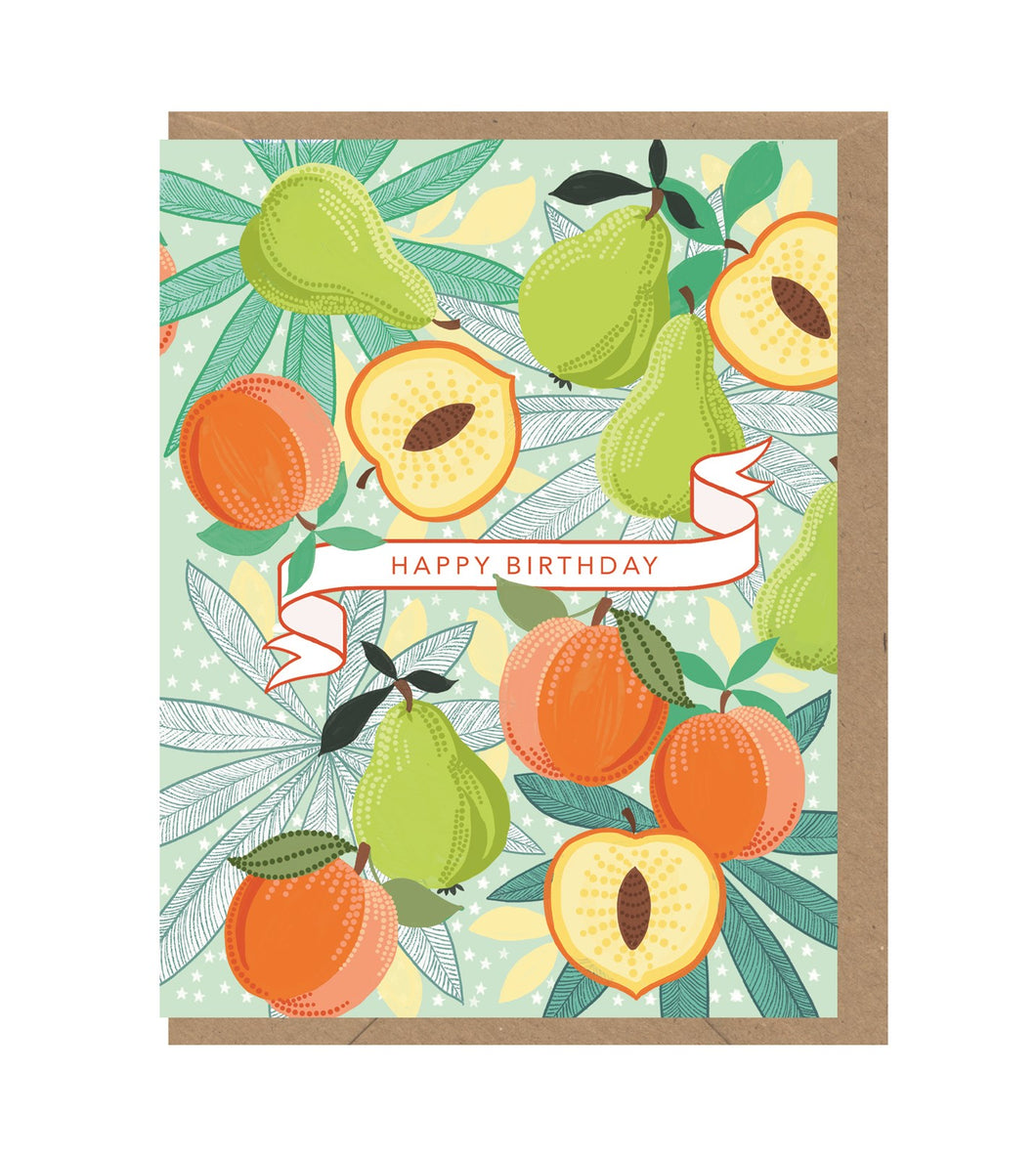 Green pears and orange apples on branches. On a white illustrated ribbon, the words 'happy birthday'. Card sits on brown envelope. 