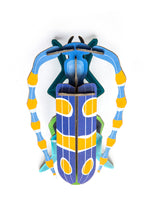 Load image into Gallery viewer, Assembled beetle made of blue and yellow card. 
