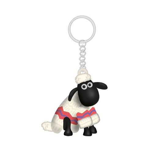 Keyring attached to a plastic sheep wearing a jumper . 