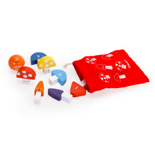 Assorted mushroom blocks in various colours outside of a red bag. Bag is printed with mushroom designs. 