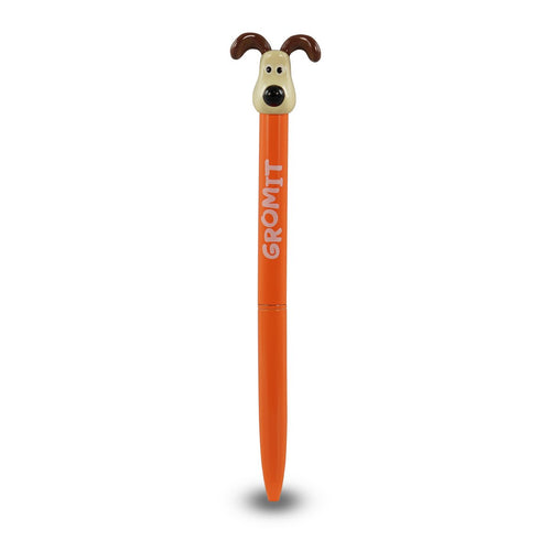 Orange pen with dog head on top. Pen reads 'Gromit'