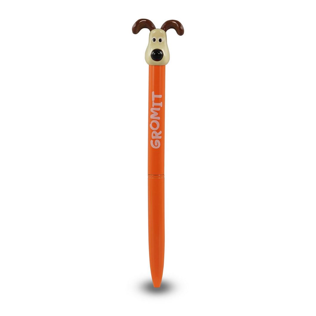 Orange pen with dog head on top. Pen reads 'Gromit'