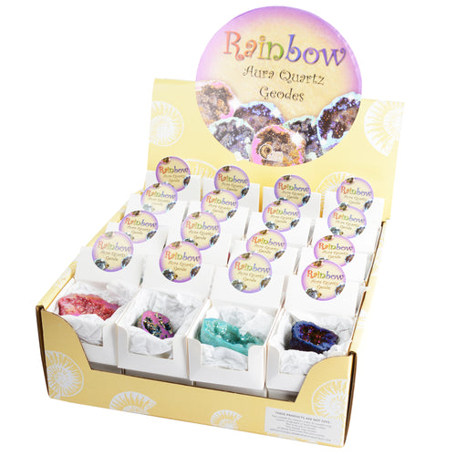 Open box shows 16 smaller boxes inside all with geodes nestled inside with crumpled white tissue paper. Boxes read 'Rainbow Aura Quartz geode'. Notice on the front of main box warns 'these products are not toys'. 4 geodes are visible: red, purple and gold, turqouise and dark blue. 