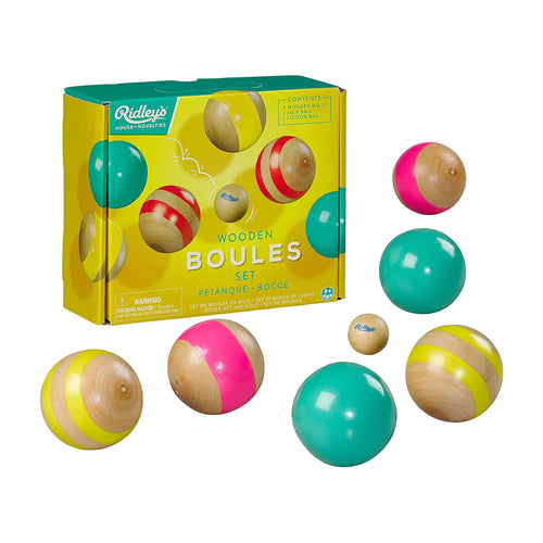 Packaging is yellow with photos of wooden balls. Around the box are 7 wooden balls, including 1 smaller sized. 2 balls have a pink stripe, two have two yellow stripes, and two are solid teal. 