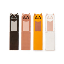 Load image into Gallery viewer, Four cat bookmarks in a row each a different colour, black, brown, yellow and white.  

The cat bookmarks are rectangular in shape with one end of the rectangle being rounded and having pointed ears to make the head of a cat. The face of a cat is printed on.
