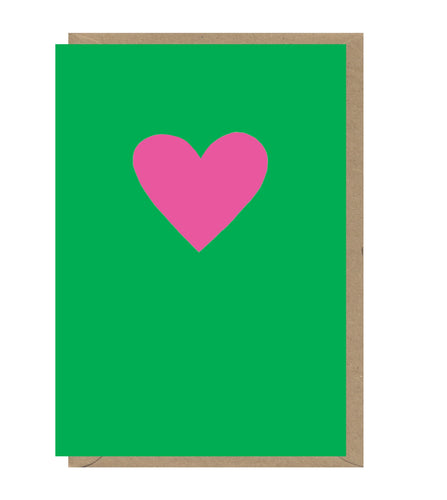 Bright green card with bright pink heart in centre. Brown envelope pokes out. 