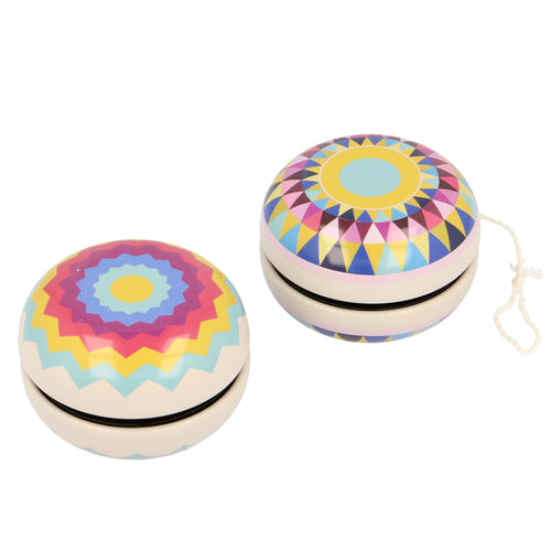 two cream yo-yo's with 2 colourful geometric designs. 