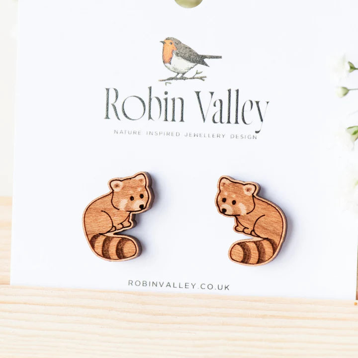 Wooden red panda earrings on a white card with 'Robin Valley' branding.