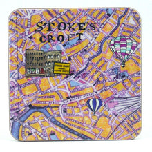 Load image into Gallery viewer, Yellow and white illustated map of Stokes Croft shows hot air balloons and some buildings. A small sign reads &#39;Bristol&#39;s cultural quarter&#39;
