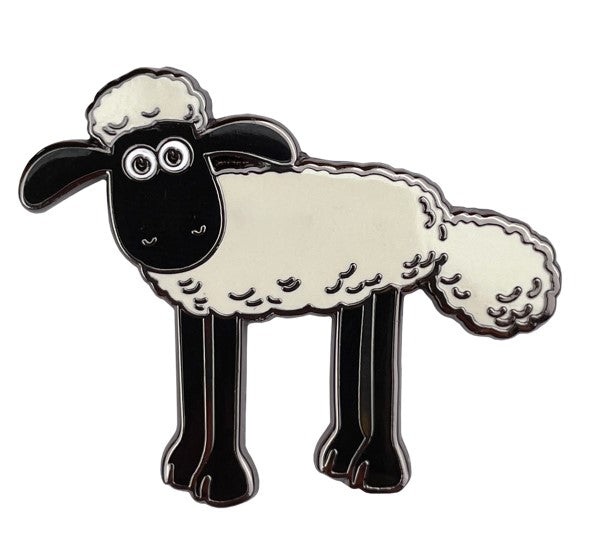 Pin badge of black and white sheep with his head turned to the viewer. 