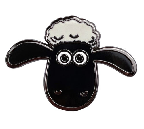 Sheep head with black head and white wool on the top. 