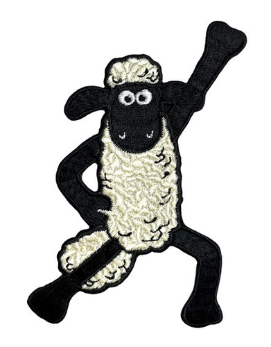 Black and white sheep standing in a disco pose with one hand on his hip and the other in the air. 