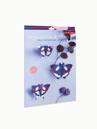 Lilac coloured box with assembled 3 butterflies. 