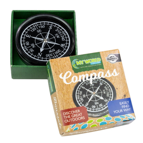 Black compass with white numbers, letters and arrows sits in a green square box. Lid of the box rests against this, and reads 'My World Compass, discover the great outdoors, easily find your way.' 