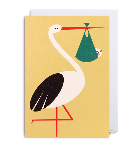 yellow card with a stork carrying a white baby with red hair and cheeks.