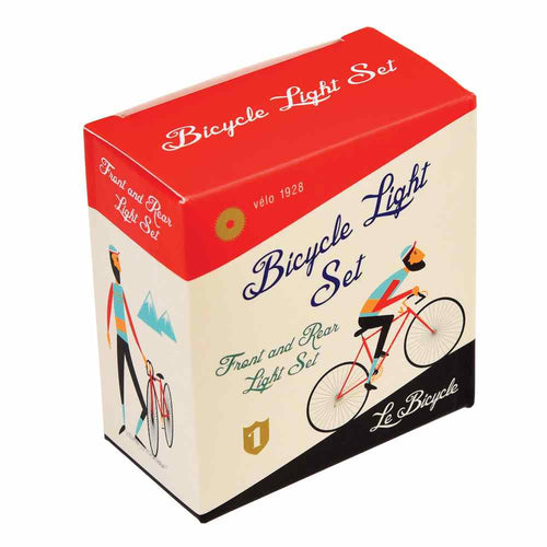 Box is white, red and black and shows illustration of a man cycling up a hill. Words on the box are 'bicycle light set, front and rear light set, le bicycle'. 