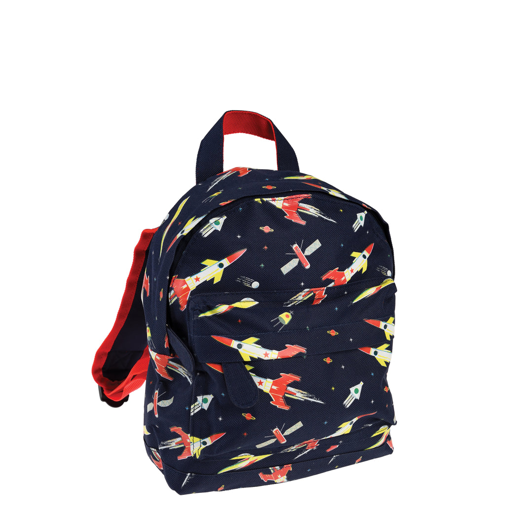Blue backpack with illustrations of red, white and yellow rockets. 