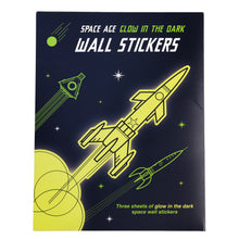 Load image into Gallery viewer, Dark blue packaging with yellow rocket illustrations reads &quot;Space Age Glow in the Dark Wall Stickers. Three sheets of glow in the dark space wall stickers&quot;.
