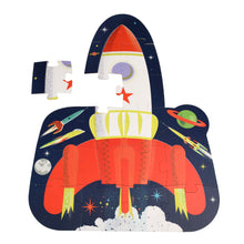 Load image into Gallery viewer, Mostly completed puzzle with one piece set to the side. Puzzle is shaped like the rocket (rectangle and half oval connected). Image on puzzle is same as illustration on box. 
