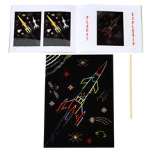 Load image into Gallery viewer, A scratch art sheet featuring a rocket partially uncovered with the wooden stick beside it and the open booklet above it. Booklet is open to the same artwork. 
