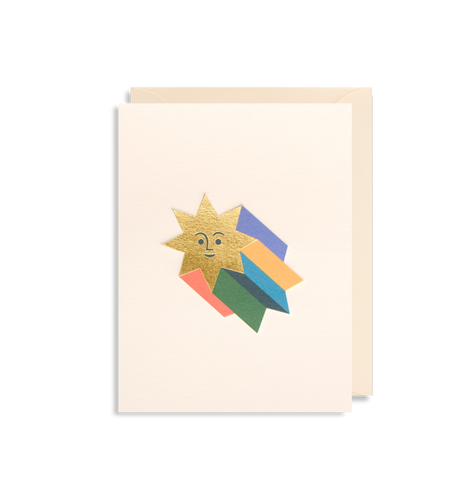 White card with cream envelope tucked in. Gold foil star with smiley face and colourful stripes (pink, green, 3 different blues, and yellow)  coming from it to make it look 3D. 