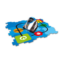 Load image into Gallery viewer, Woki Robot sits on a blue puzzle mat with colourful decals connected by a black line. 
