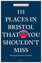 Load image into Gallery viewer, Dark blue cover reads &#39;Martin Booth, 111 Places in Bristol that you shouldn&#39;t miss, photographs by Barbara Evripidou, emons:&#39;. In between the words floats a solitary hot air balloon with pink, yellow, nlue and red stripes. 
