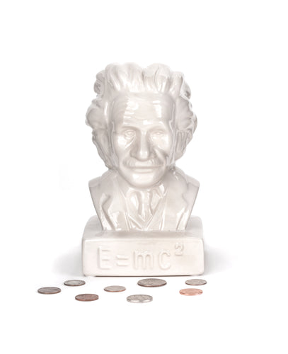 Albert Einstein money bank is white and shaped into Albert Einstein's (a white man) bust. On the plinth is E= MC2.