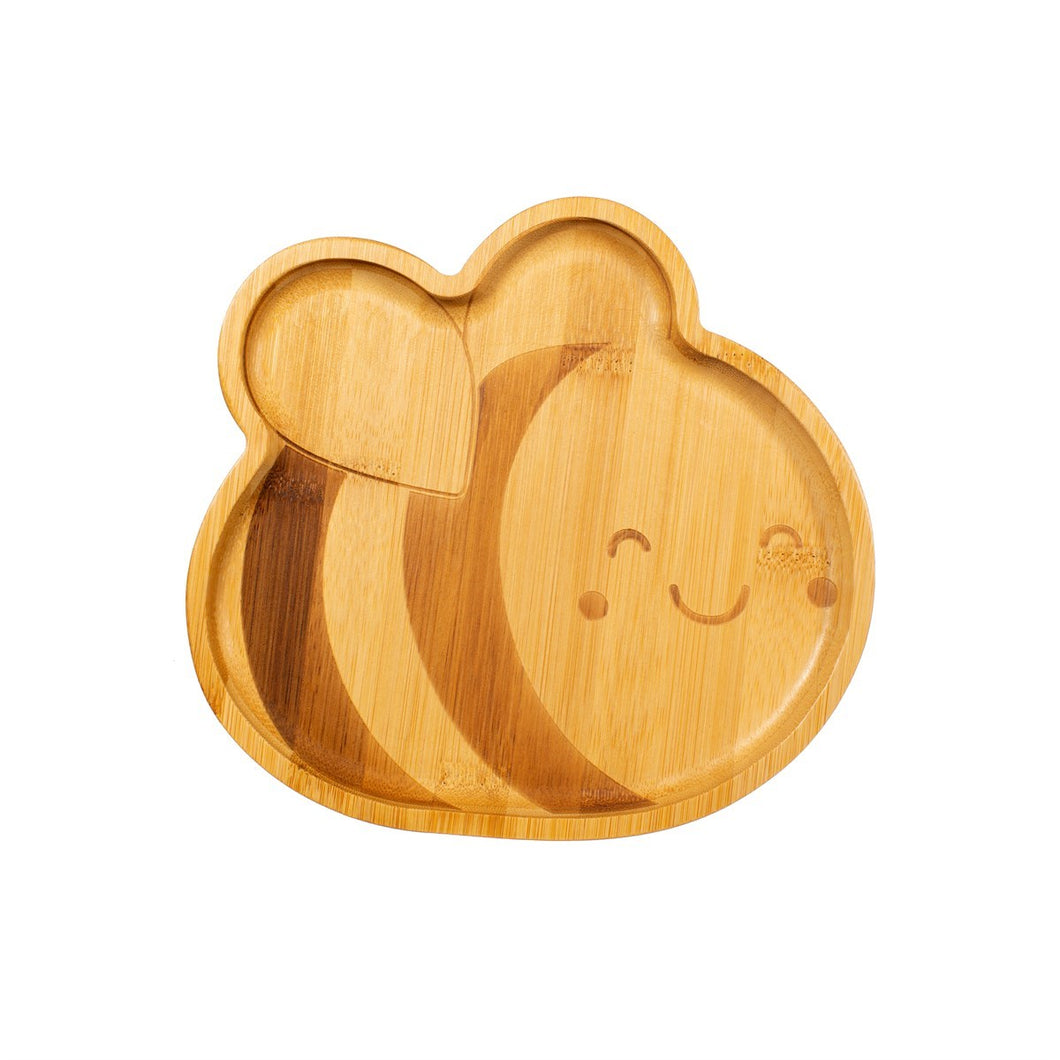 Wooden plate is in the shape of a bee. The bee has two stripes, two wings and a smiling face.