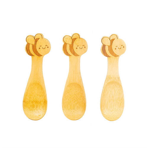 Three wooden spoons have smiling bees on the handles