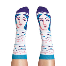 Load image into Gallery viewer, Socks being worn by someone with light-coloured skin, with sock pulled up the calf.
