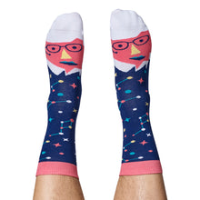 Load image into Gallery viewer, The pair of socks are on light-skinned feet, stretching up the calf. 
