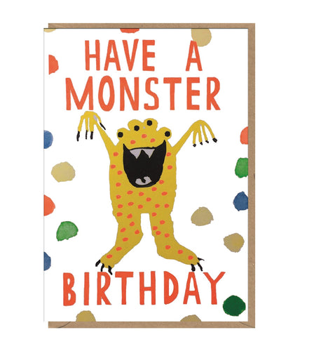 White card with brown kraft envelope tucked inside. Spots made to look like paint are scattered around an illustration of a spotted yellow, four eyed monster. The card reads 'Have a Monster birhday' in red orange letters.