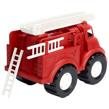 Load image into Gallery viewer, Rear of fire engine with one of the removable ladders leaning against the back and the other removable ladder pulled halfway out. 
