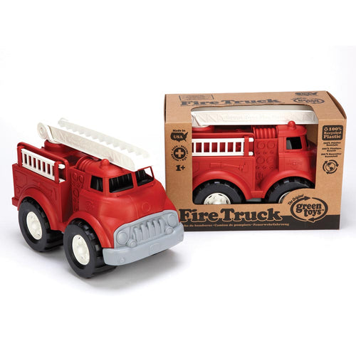 One fire truck inside a cardboard box with cut-out to show the truck. Another truck is displayed outside the box with the ladder flat. Fire engine is red with black tired, white rims, grey grill, white ladders and black cab interior.