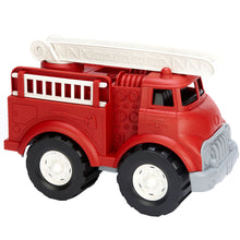 Load image into Gallery viewer, Fire engine shown from the right hand side. Carved detailing to show gadges, axe, and &#39;GTFD&#39; which stands for &#39;Green Toys Fire Department&#39; which is written out on the top ladder. 
