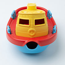 Load image into Gallery viewer, Front view of the tugboat shows raised lifeboat detail on cabin, and letters &#39;S.S. Green Toys&#39; above cabin windows. 
